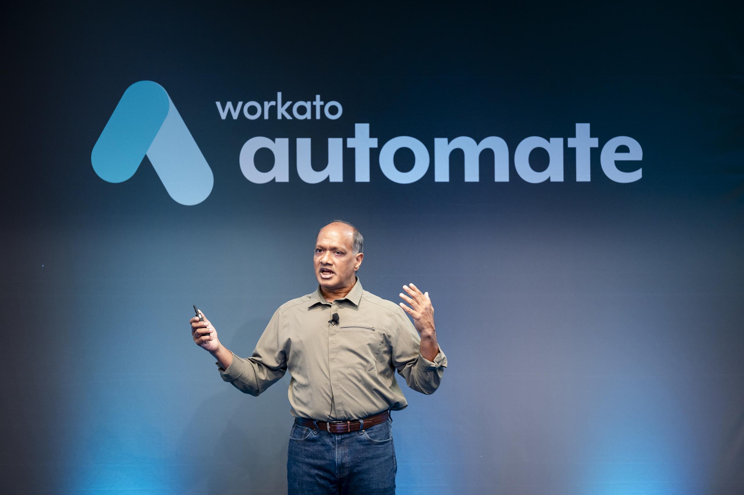 Workato Founder, Vijay Tella, speaking at event.